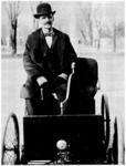 Henry Ford in his first car