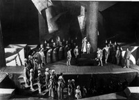 In this photograph from scene 7 of The Dawns, Meyerhold and Bebutov bridge the forestage and audience with a chorus of actors who form an unbroken human link between the two.