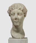 Photograph of head of a female portrait statue, frontal view.