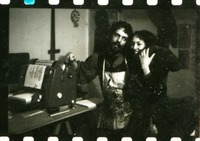 Carolee Schneemann and Felipe Ehrenberg with mimeograph machine and cat.