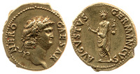 Photograph of an aureus of Nero. Reverse: togate Nero holding in his left hand a statuette of Victoria standing on a globe and in his right hand a branch, probably a palm.}