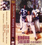 One of the previously shown album covers for the music group Abdou Salam and Les Tendistes. The cover, which has English writing on it, portrays two men standing on outdoor steps with trees in the background, with a third man sitting on a stool between them giving a thumbs up. The name of the group is written below the men, and the album’s track listing is written sideways on the left side of the cover.