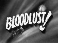 The title "Blooklust!" is brushed, with a drop shadow effect that imparts a sense of movement. It is superimposed over a montrous figure crawling out of an aperature.