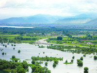 Panoramic view of Shkodër Lake and Shtoj alluvial fan that partially forms Bjeshkët e Namuna Mountains, pictured in background.