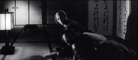 Three people bow in a dark room with a lantern and calligraphy on the walls. One raises their head slightly to look towards the viewer.