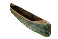 A color photograph of a dugout canoe.