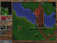 A screenshot from Warcraft: Orcs & Humans, where Orc units attack Human units individually from one side of a bridge.