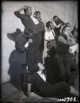 Actors stand in a variety of positions, each the personification of shocked dismay, to pose for the creation of the dumb-show mannequins that replaced their live bodies at the end of Meyerhold’s Inspector General.