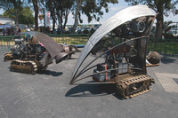 Photograph of several steampunk-­style vehicles displayed outdoors at the Makers Faire.