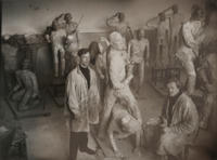 This photograph shows the Inspector General dumb show mannequins, made by V. M. Petrov, in the process of being created. The bodies are newspaper papier-maché over wire armatures, while the faces (with surprised expressions) are wax. The figures are permanently attached to the small platforms on which they later stood at the end of the production.