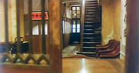 A half-closed door in the foreground, with metal bars in its center opening within a wood frame, reveal a foyer. It contains a service counter, two red cushioned chairs at the foot of a staircase that's set beside a narrow hallway leading directly to a back door. A red sign is hung on the wall next to the counter.
