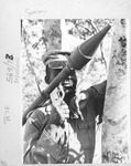 Fig. 23. Frelimo photographer José Soares pictures a Frelimo soldier posed next to a tree and holding a bazooka over his soldier.