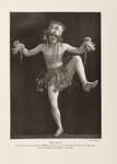 A sepia photograph of a revue dancer, Miss Lerol. Here, she stands on one leg, raises her bent arms, and smiles at the camera. She wears an oversized cylindrical hat decorated in triangles with tendrils falling like hair, a top with musical staff decoration around her chest, and a tattered skirt. She has corsages of bunched-up fabric and lace on her wrists with two ribbon endings hanging from each accessory.