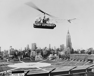 The words “Port Authority” were prominently emblazoned on the side of the helicopter. The Empire State Building is visible in the background.