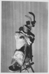 The black and white photograph from The Doll (1934) by Hans Bellmer exploits light-and-shadow effects to produce a full double image of the doll. At this stage, the doll consists of a wooden skeleton head, a molded plaster torso, and wooden ball joints for the hips.