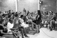 Photograph of participants speaking in the microphone during a Codespa meeting.