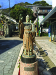 Photograph of Chinese pirate Wang Zhi’s statue in Nagasaki. He stands holding a sword