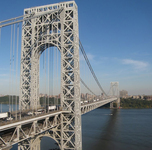 The two-­level suspension bridge is 9/10 of a mile long and its towers are more than 600 feet above the Hudson River.