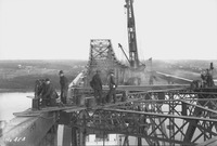 Workers on the steel structure high above the Arthur Kill.