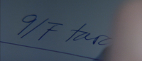 Closeup of handwriting in blue ink.