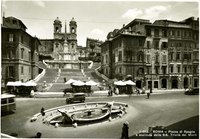 This postcard of the Piazza di Spagna in Rome shows the Spanish Steps at its center and the Fontana della Barcaccia in the foreground.