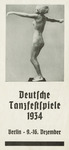 The cover for the German Dance Festival of 1934 featuring a black-and-white photograph of a dancer sculpture by Georg Kolbe. The dancer is rendered classically with slight movement in the body; her hair seems slightly windswept; her face is calm and focused; her arms gesture outward in front of and behind her while her feet appear mostly planted on a small platform. The program’s title and dates are typeset below the photograph.
