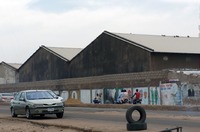 Large warehouses used for storing textiles near Kano market.