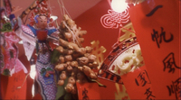 Ginger, decorations, and red banners dangle together.
