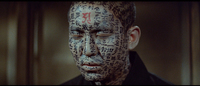 Japanese characters that covering the whole face of the man