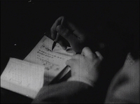 0:30:30, a man writing a check with a brush
