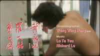 Opening credits for music and cinematography are written horizontally in red, typefaced English on the right side. Chinese names are brushed, while their role is rendered in typeface on the left. These are superimposed over a screenscape of a man.
