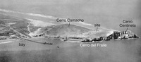 A 1920s black-and-white aerial photo of Cerro Azul with labels indicating the bay, Cerro Camacho, the Late Intermediate residential compounds, and the sea cliffs known today as Cerro del Fraile and Cerro Centinela.