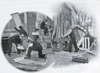 Photograph of six men outdoors, working to build theater sets.