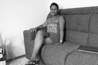 Photograph of Delci in her apartment.