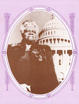 McLeod, in a three-quarter view, stands in a warm coat in front of the Capitol Building. Set in an oval decorative border. She has a warm, yet fierce, closed-mouth smile.