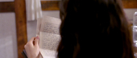 Protagonist reads handwritten letter