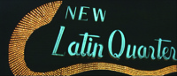 The Libidnal Economy: An elaborate neon sign for a nightclub fills the entire frame, with the words “NEW Latin Quarter” in giant-­sized, cursive blue lettering with a florid, twisting row of yellow lights underscoring the letters.