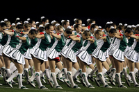 Fig. 31. A photograph of a girls’ cheer or pep squad on a field.