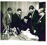 From the office of the Rev. Clay Evans, a photograph of the signing between Operation Breadbasket and the A&P grocery store chain to employ more African-American workers. King (third from left) and Jesse Jackson, who spear-headed Operation Breadbasket (second from right) were party to the signing, along with representatives from A&P.