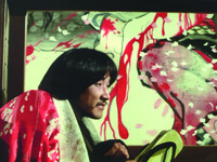 Closely framing Middle Shot of a seated, hunched, smugly satisfied Matsuzaki on what appears to be (thanks to the camera movement) a moving train, except that the “background” outside of the train’s glassless windows is an Edo-­style, but tremendously violent painting, with generous streams of deep red blood covering a robed figure of white, grey, and subtle green.