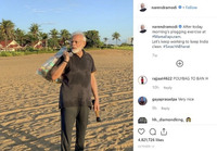 A screenshot of a post by the “narendramodi” Instagram account, which is dated October 12 and has almost five million likes. The post shows Narendra Modi standing on a beach in a sweat-­stained dark collared shirt, holding what appears to be a bag of litter over his shoulder and a small, cylindrical object in his right hand. The post is captioned “After today morning’s plogging exercise at #Mamallapuram. Let’s keep working to keep India clean. #SwachhBharat.”