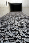 Figure 7.2. Photograph of the Shalekhet (Fallen Leaves), an installation by Menashe Kadishman comprising more than ten thousand steel faces representing the victims of war and violence, arrayed on the floor of the Jewish Museum in Berlin