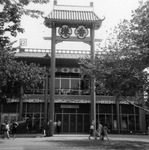 Black and white photo, 1964 New York World’s Fair, Hong Kong Pavilion, archway, rickshaw parked at front