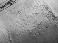 Detail of photograph of inscription on mask.