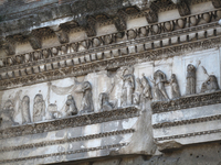 View of the frieze decorating the entablature. The relief shows Minerva in the company of women spinning and weaving. The goddess strikes a kneeling woman who has been identified as Arachne.