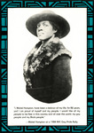 Three quarter view. Hampton turns toward the viewer with a warm yet defiant look. She wears a broad-brimmed hat and a warm coat with long fur collar. See Resources for full quote.