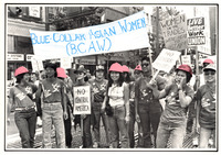 Women march on Market Street in San Francisco in BCAW T-shirts and hard hats. Two hold a BCAW flag and others hold signs. See Resources for names and occupations of women.