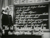 A classroom of a German elementary school, children are singing the hymn for Hitler and the lines are shown in English at the bottom, white typed letter