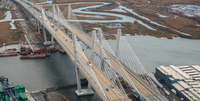 The cable-­stayed bridge spans the Arthur Kill.