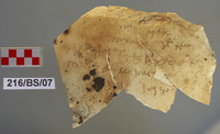 Fig 16: Ostraka 8 inscribed on convex side only, parallel with the throwing marks. Script is semicursive, with a number of sigla. It might be a receipt for land-tax payment in wheat.
